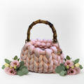 Knitted pink bag angled